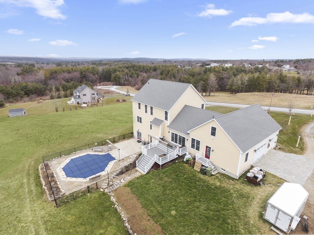 35 Piasta Road Dudley, MA 01571 - Photo 5 of 42 an aerial view of a house with a garden and mountain view