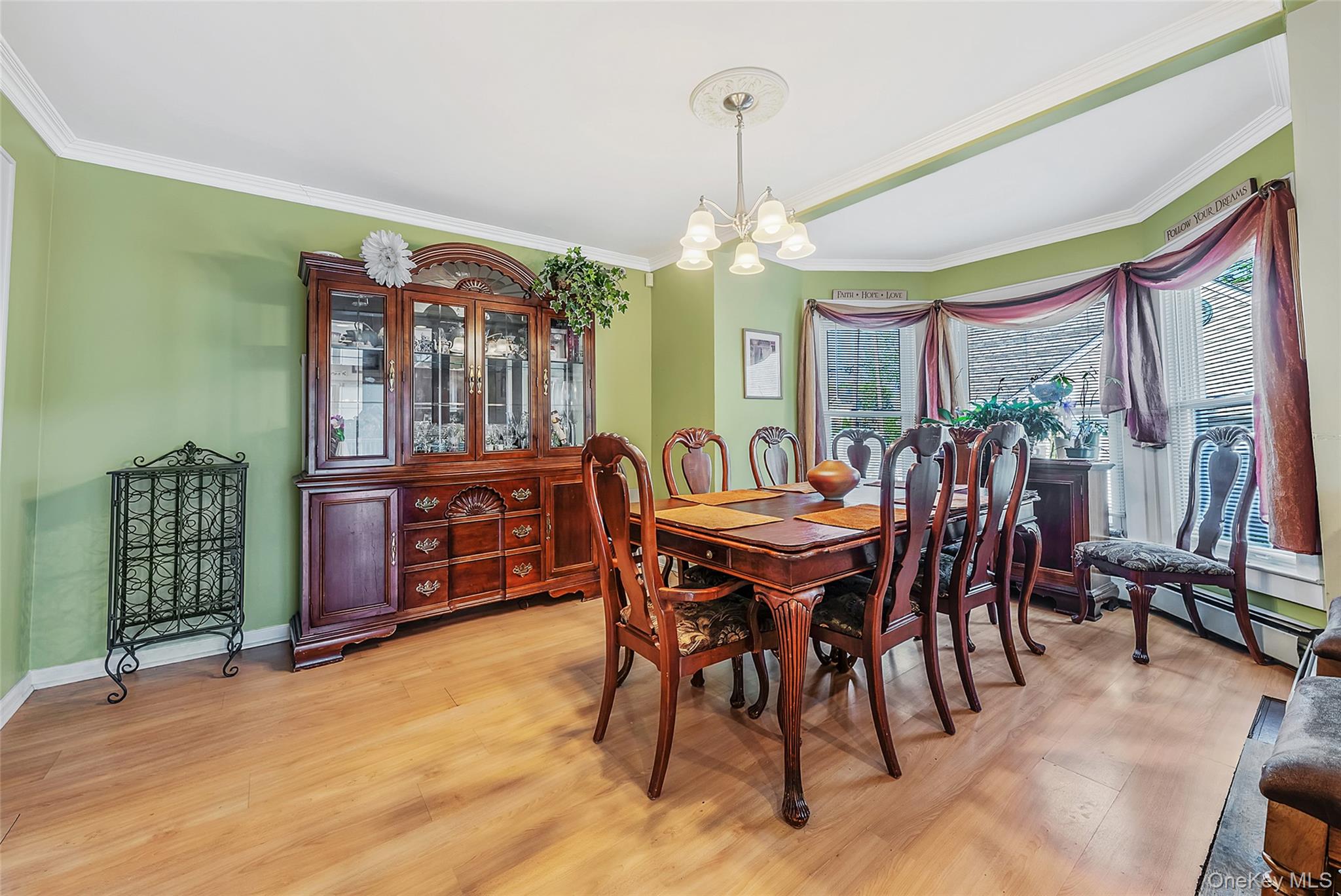 80 George Street Babylon, NY 11702 - Photo 11 of 41 a dining room with furniture a chandelier and wooden floor