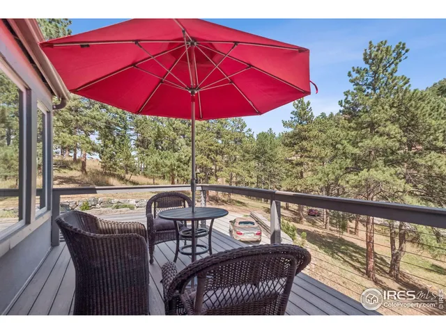 a view of balcony with outdoor seating and wooden floor