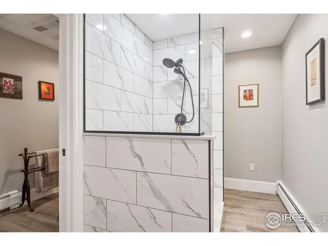 a view of a chairs and table in the balcony