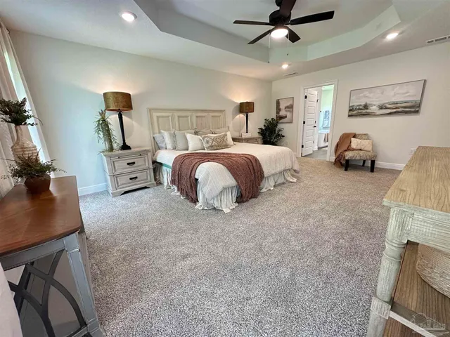 a bedroom with bed and window