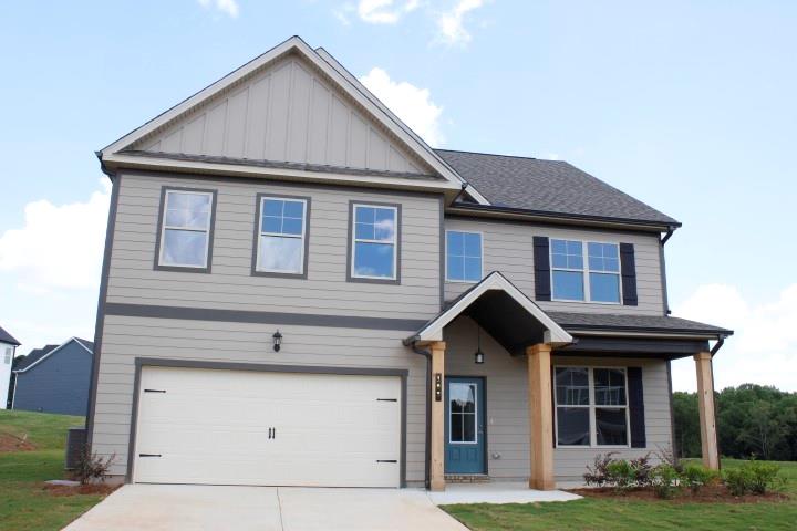 76 Shelby Court Commerce, GA 30529 - Photo 1 of 4 a front view of a house with garden
