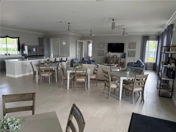 a room with gym equipment and a flat screen tv