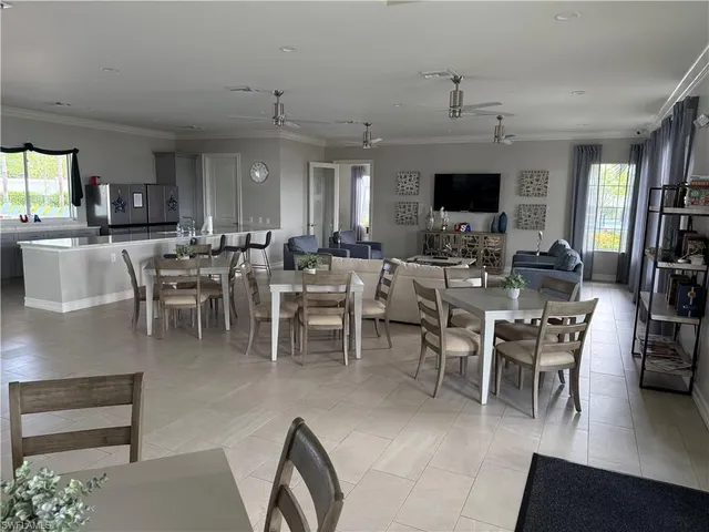 a room with gym equipment and a flat screen tv