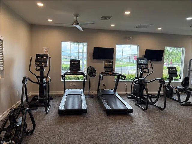 a view of a livingroom with furniture and a flat screen tv
