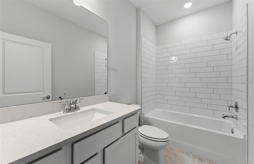 8343 Southwest 58 Loop Ocala, FL 34481 - Photo 11 of 34 a bathroom with a sink a toilet and bathtub