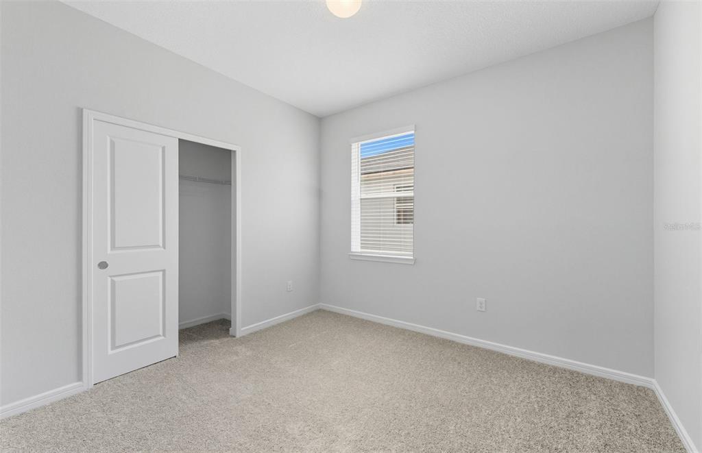 8343 Southwest 58 Loop Ocala, FL 34481 - Photo 13 of 34 an empty room with windows