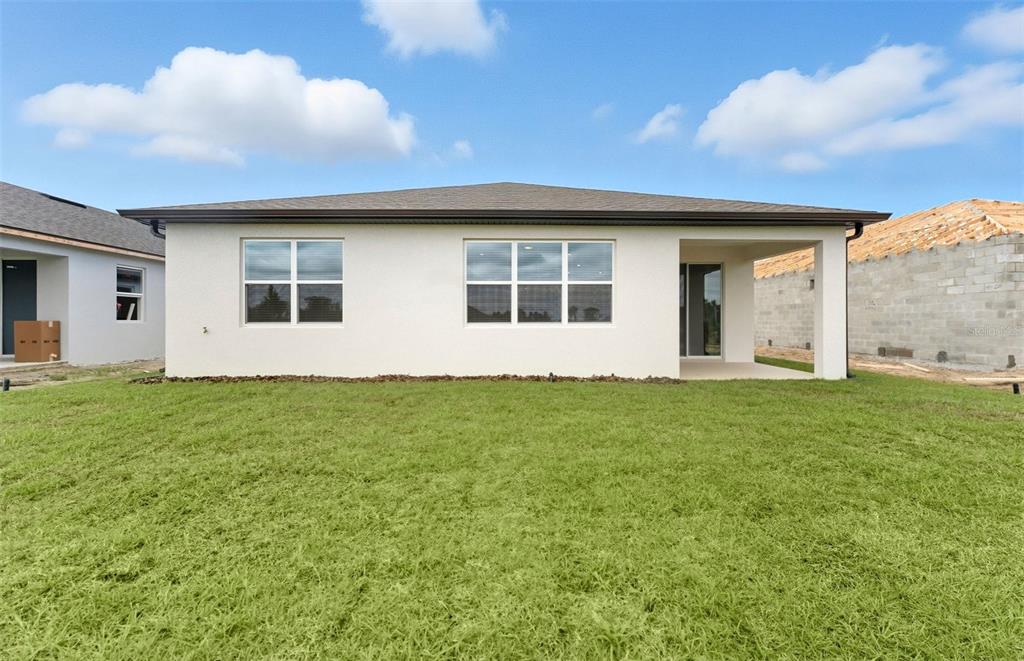 8343 Southwest 58 Loop Ocala, FL 34481 - Photo 15 of 34 a view of a house with a backyard