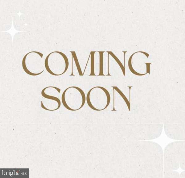 a view of a kitchen with wall mirror and a window