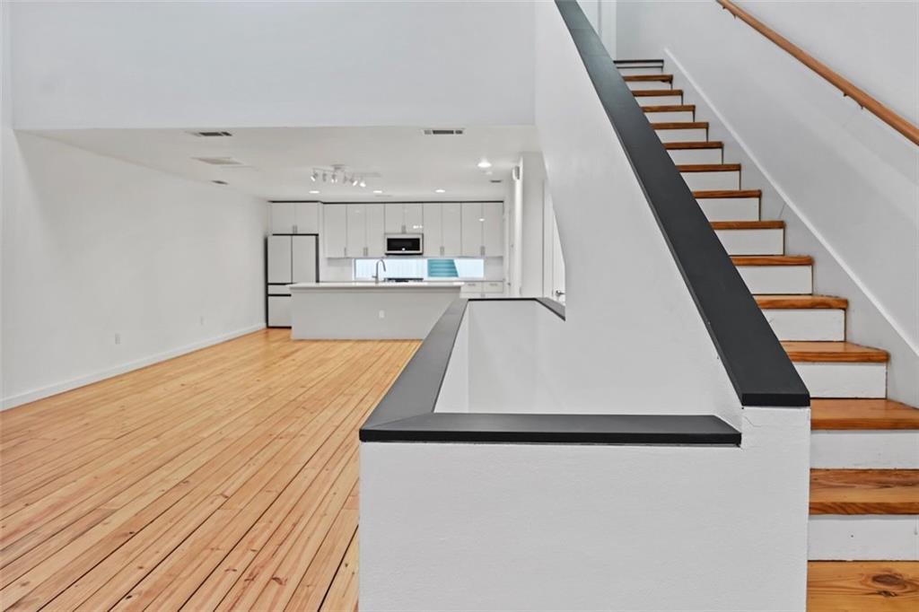 920 Memorial Drive Southeast, Unit 36 Atlanta, GA 30316 - Photo 1 of 36 a view of a kitchen with wooden floor and electronic appliances