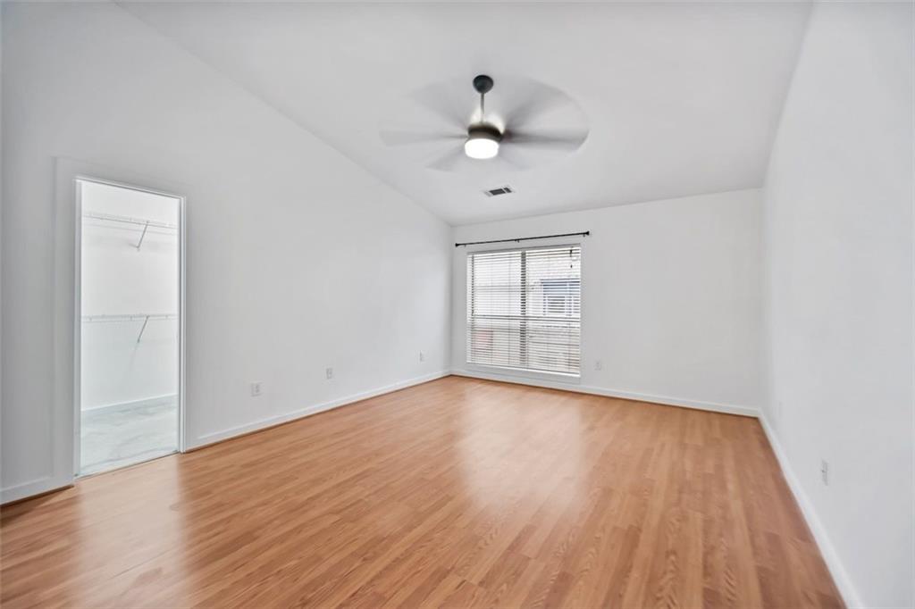 920 Memorial Drive Southeast, Unit 36 Atlanta, GA 30316 - Photo 15 of 36 a view of an empty room with wooden floor and a window