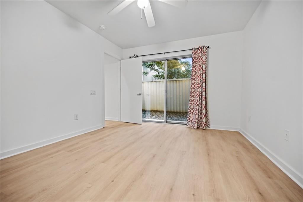 920 Memorial Drive Southeast, Unit 36 Atlanta, GA 30316 - Photo 2 of 36 wooden floor in an empty room with a window