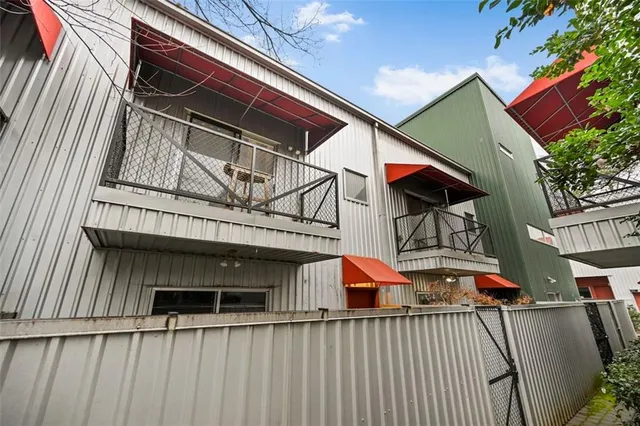 a view of a house with wooden deck