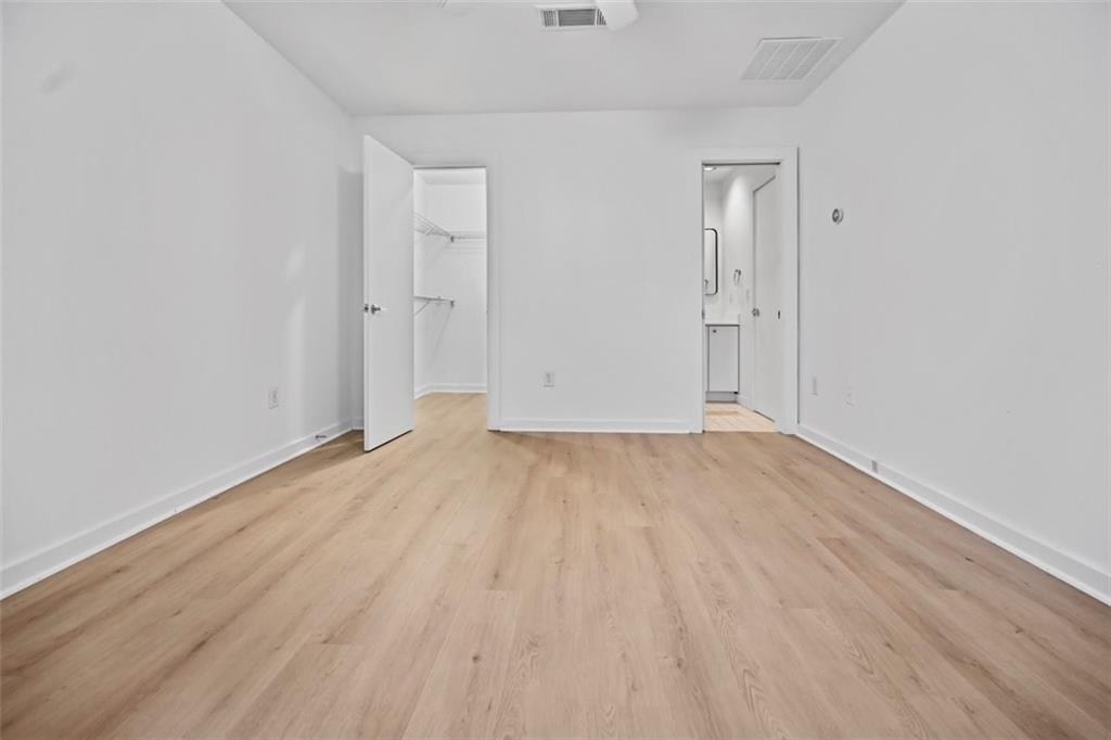 920 Memorial Drive Southeast, Unit 36 Atlanta, GA 30316 - Photo 3 of 36 a view of an empty room with wooden floor