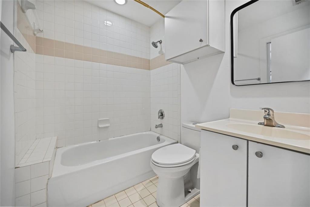 920 Memorial Drive Southeast, Unit 36 Atlanta, GA 30316 - Photo 5 of 36 a bathroom with a granite countertop sink a toilet and bathtub