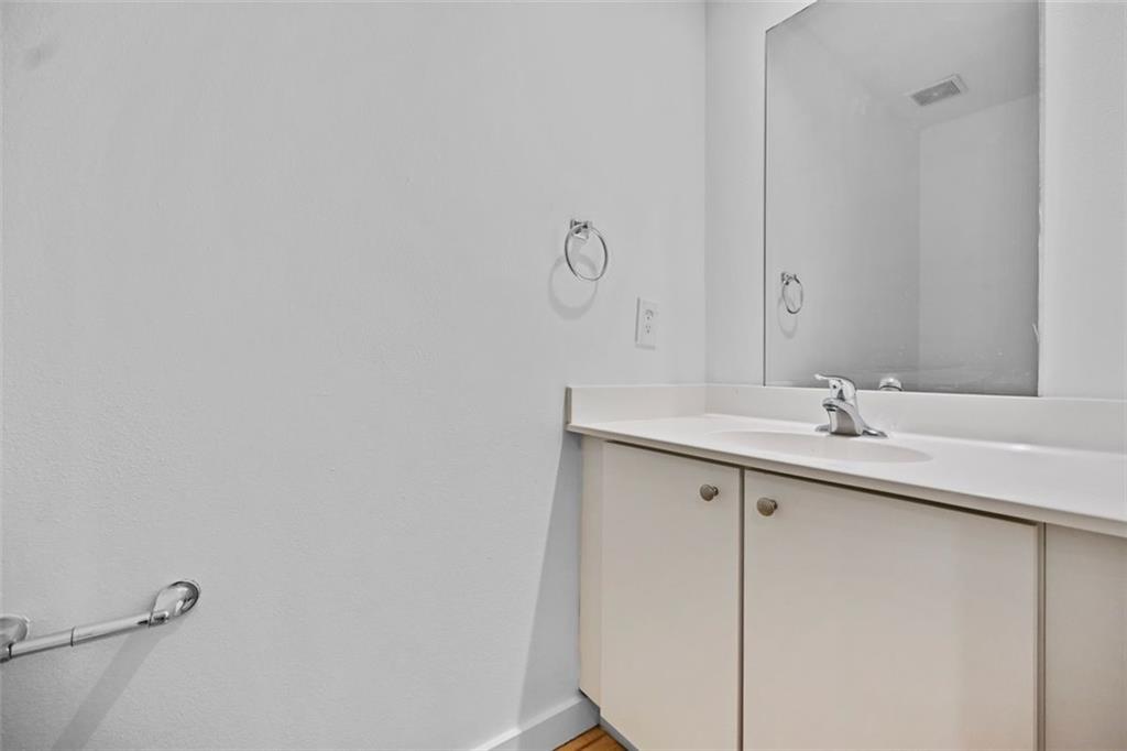 920 Memorial Drive Southeast, Unit 36 Atlanta, GA 30316 - Photo 8 of 36 a bathroom with a sink and mirror