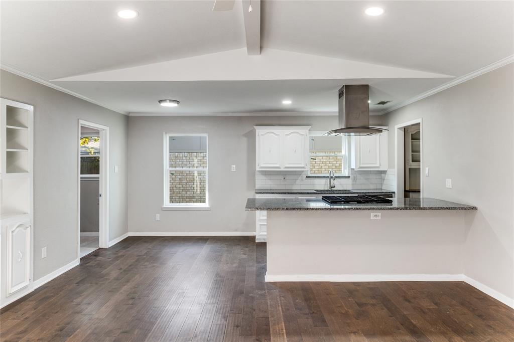 11236 Quail Run Street Dallas, TX 75238 - Photo 14 of 25 a kitchen with stainless steel appliances a sink a stove a refrigerator and wooden floor
