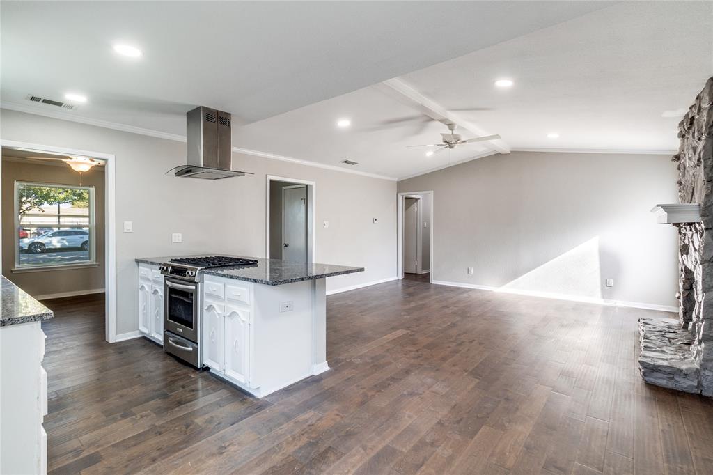11236 Quail Run Street Dallas, TX 75238 - Photo 15 of 25 a kitchen with stainless steel appliances a stove top oven a sink dishwasher and a refrigerator