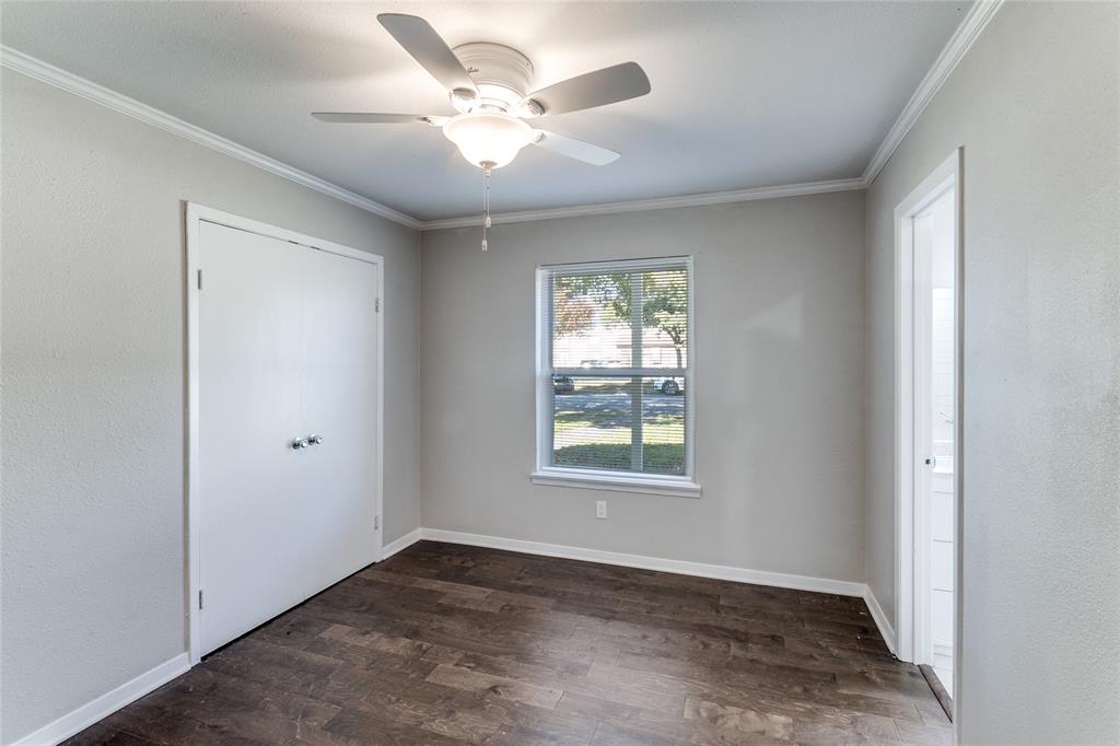 11236 Quail Run Street Dallas, TX 75238 - Photo 19 of 25 a view of an empty room with a window