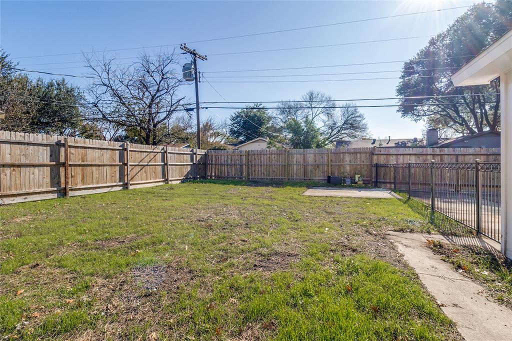 11236 Quail Run Street Dallas, TX 75238 - Photo 24 of 25 a view of backyard with a small garden