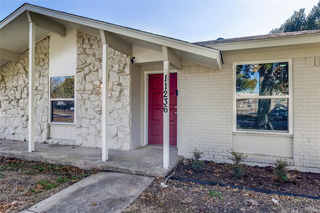 11236 Quail Run Street Dallas, TX 75238 - Photo 3 of 25 a front view of a house with a yard