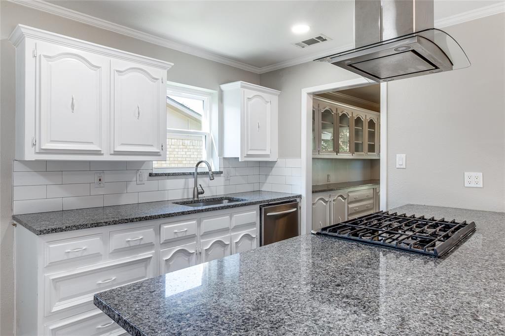 11236 Quail Run Street Dallas, TX 75238 - Photo 10 of 25 a kitchen with stainless steel appliances granite countertop a sink stove and cabinets