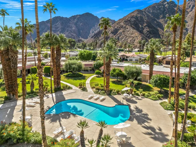 a view of a swimming pool with a patio