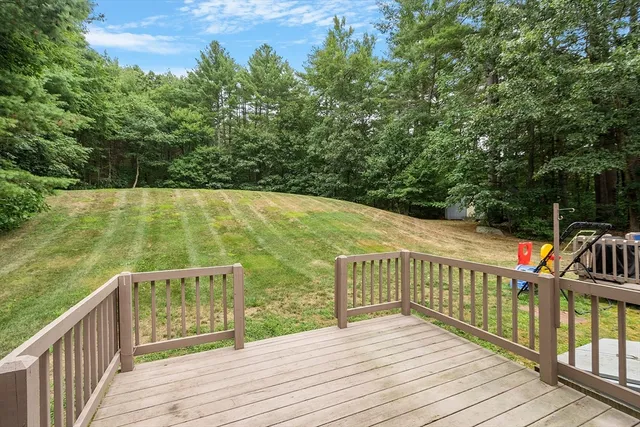 a view of a balcony with wooden floor