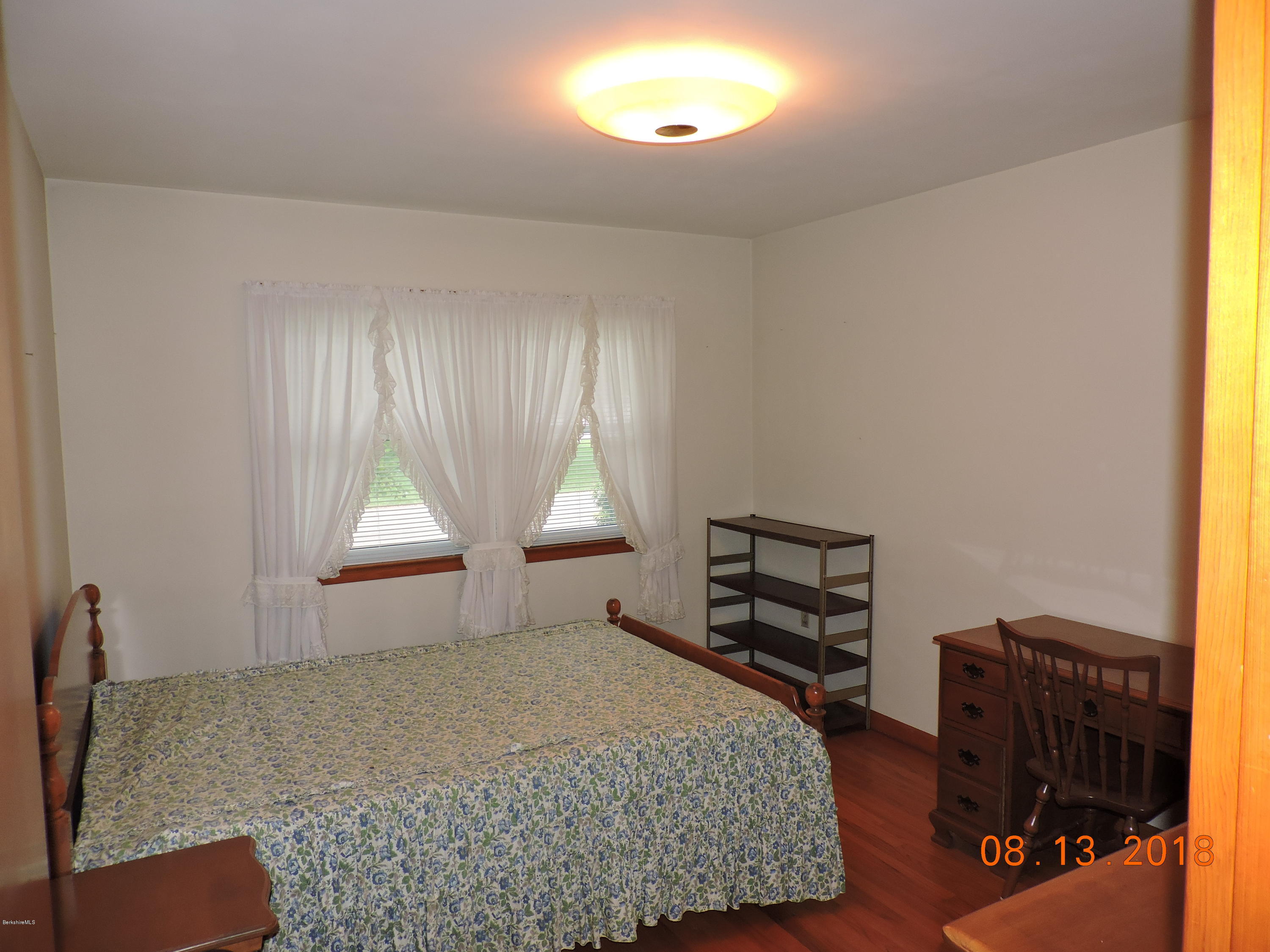 14 Calumet Street Pittsfield, MA 01201 - Photo 14 of 26 a bedroom with a bed and a window