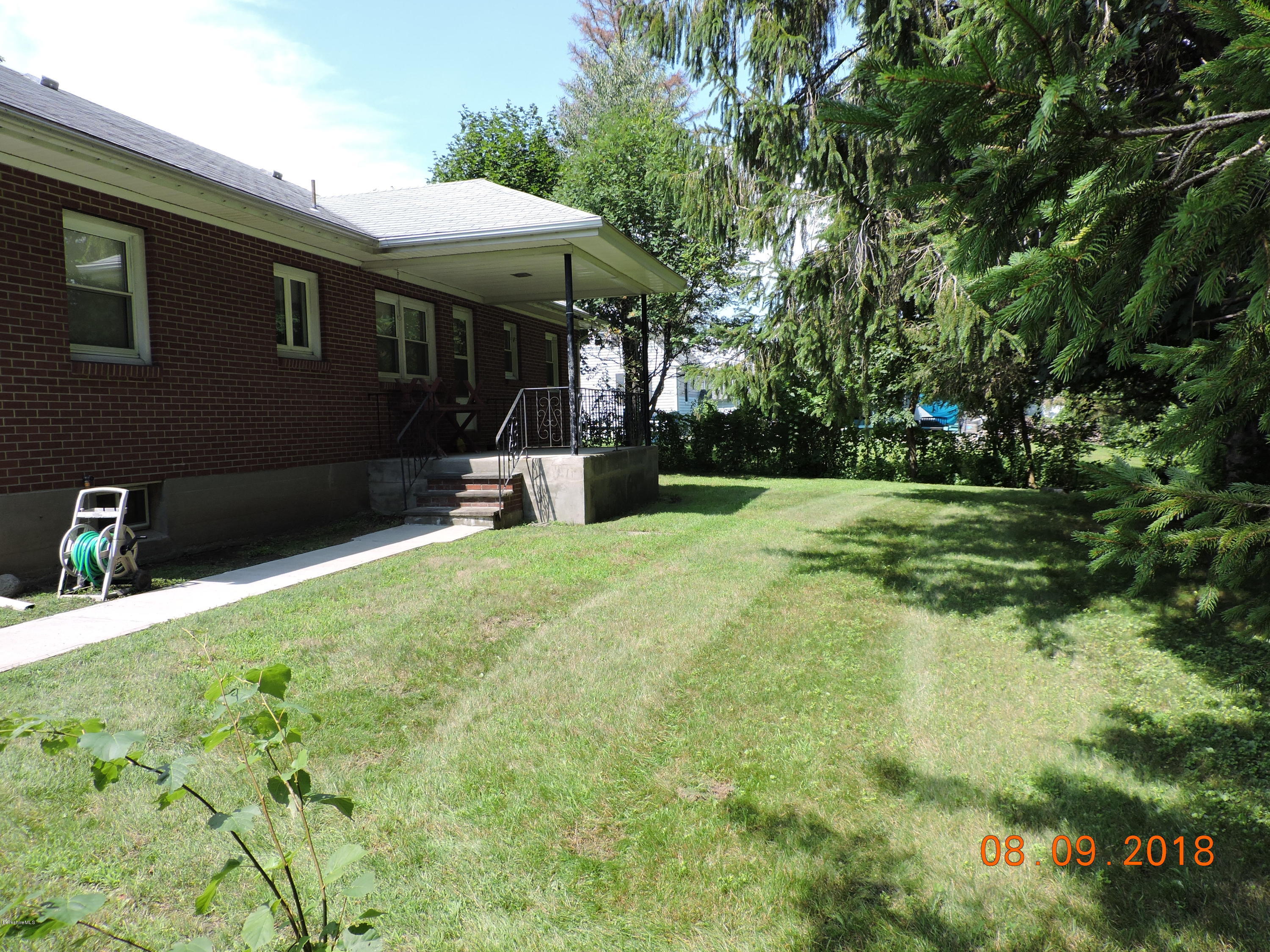 14 Calumet Street Pittsfield, MA 01201 - Photo 6 of 26 a view of a house with backyard and sitting area
