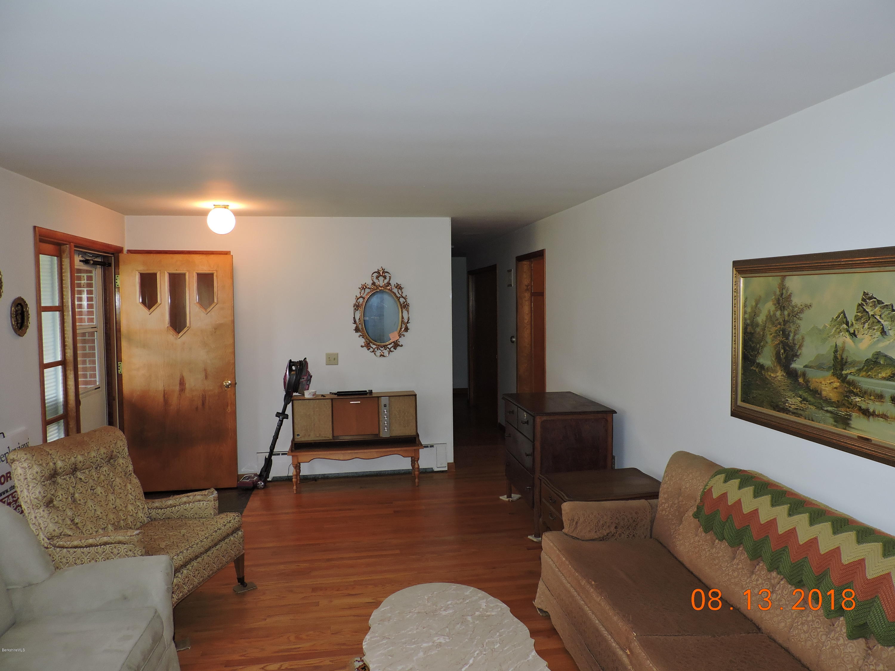 14 Calumet Street Pittsfield, MA 01201 - Photo 7 of 26 a living room with furniture and wooden floor