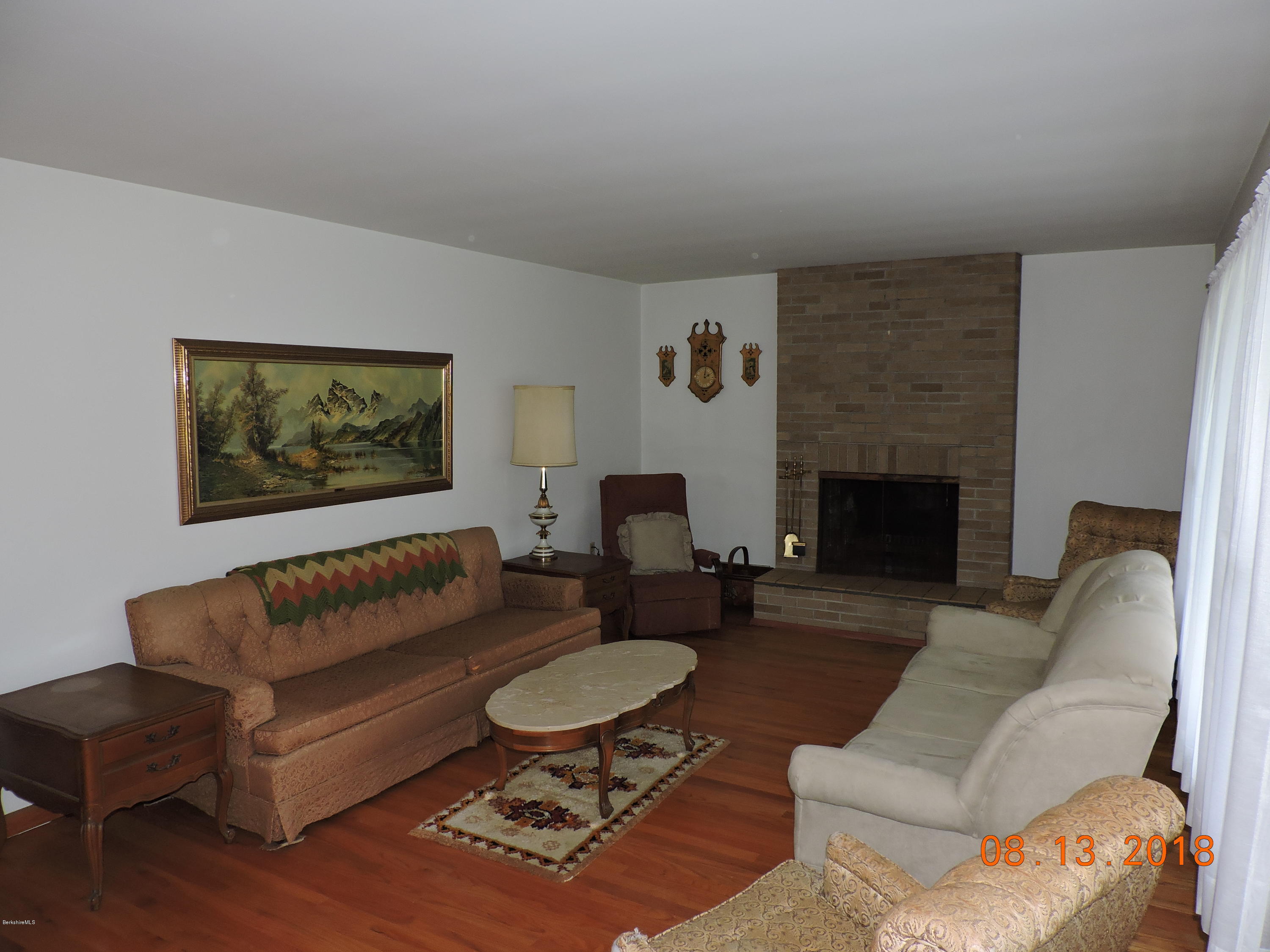 14 Calumet Street Pittsfield, MA 01201 - Photo 8 of 26 a living room with furniture and a fireplace