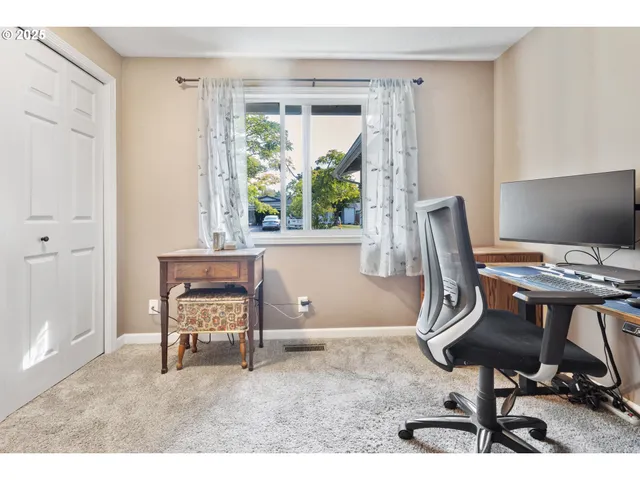 a workspace with furniture and a window