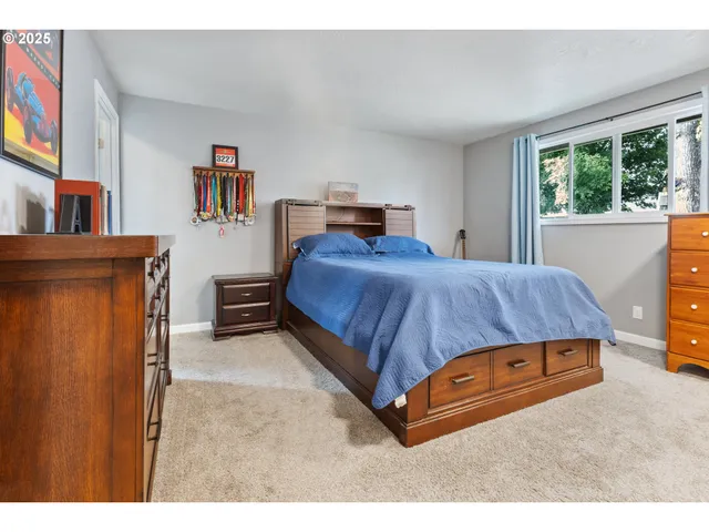 a bedroom with a bed and window