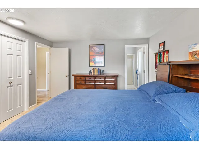 a bedroom with a bed and a cabinets