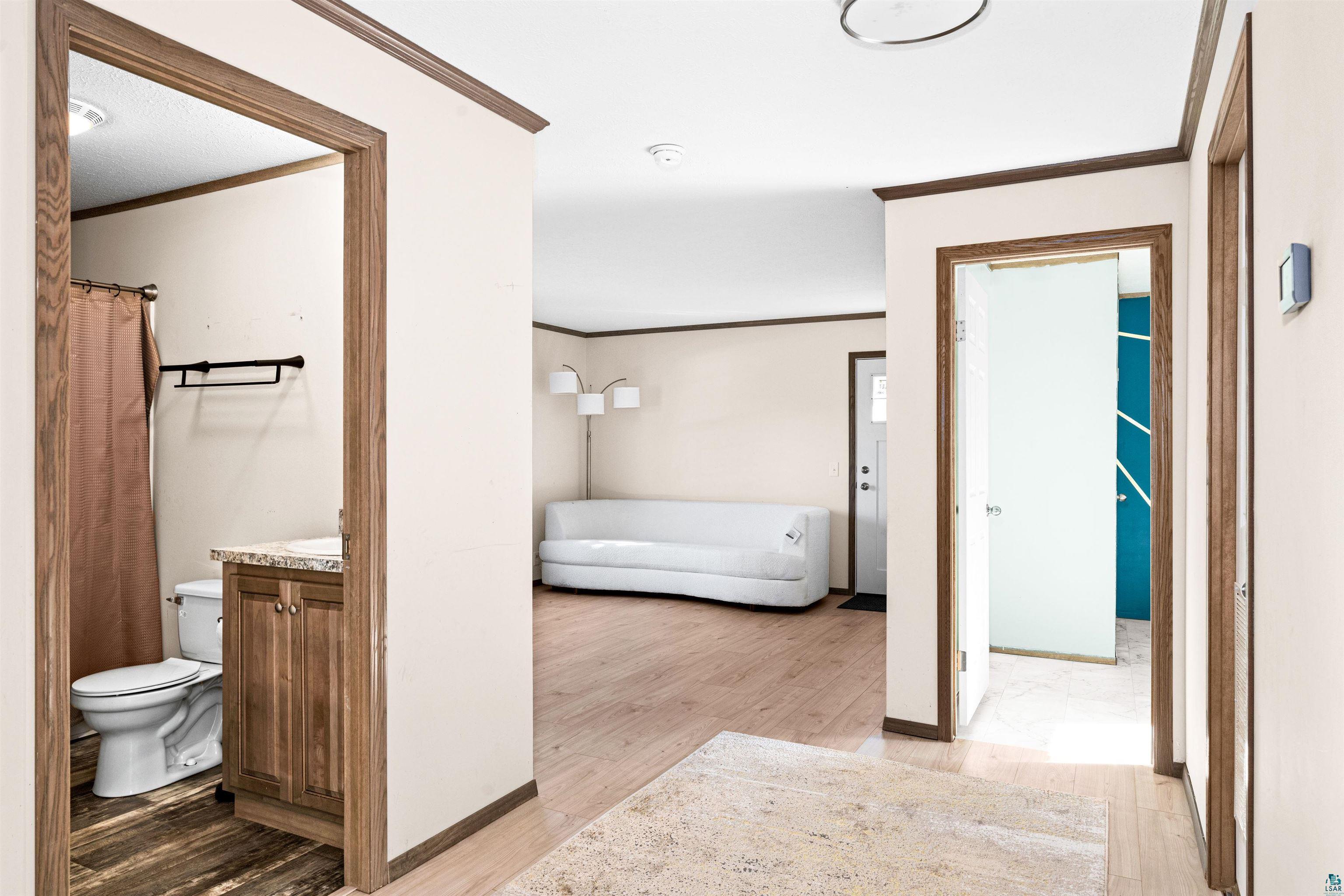 5562 Lavaque Road Duluth, MN 55803 - Photo 14 of 28 Hall featuring crown molding and light hardwood / wood-style floors