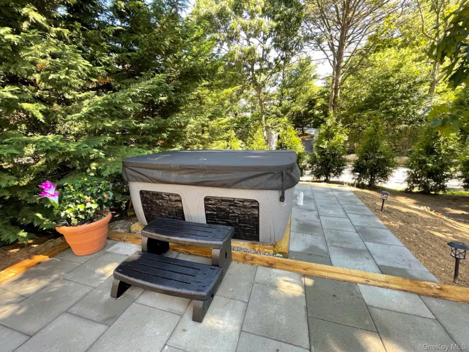 332 Canoe Place Road Southampton, NY 11968 - Photo 12 of 19 a outdoor space with chairs