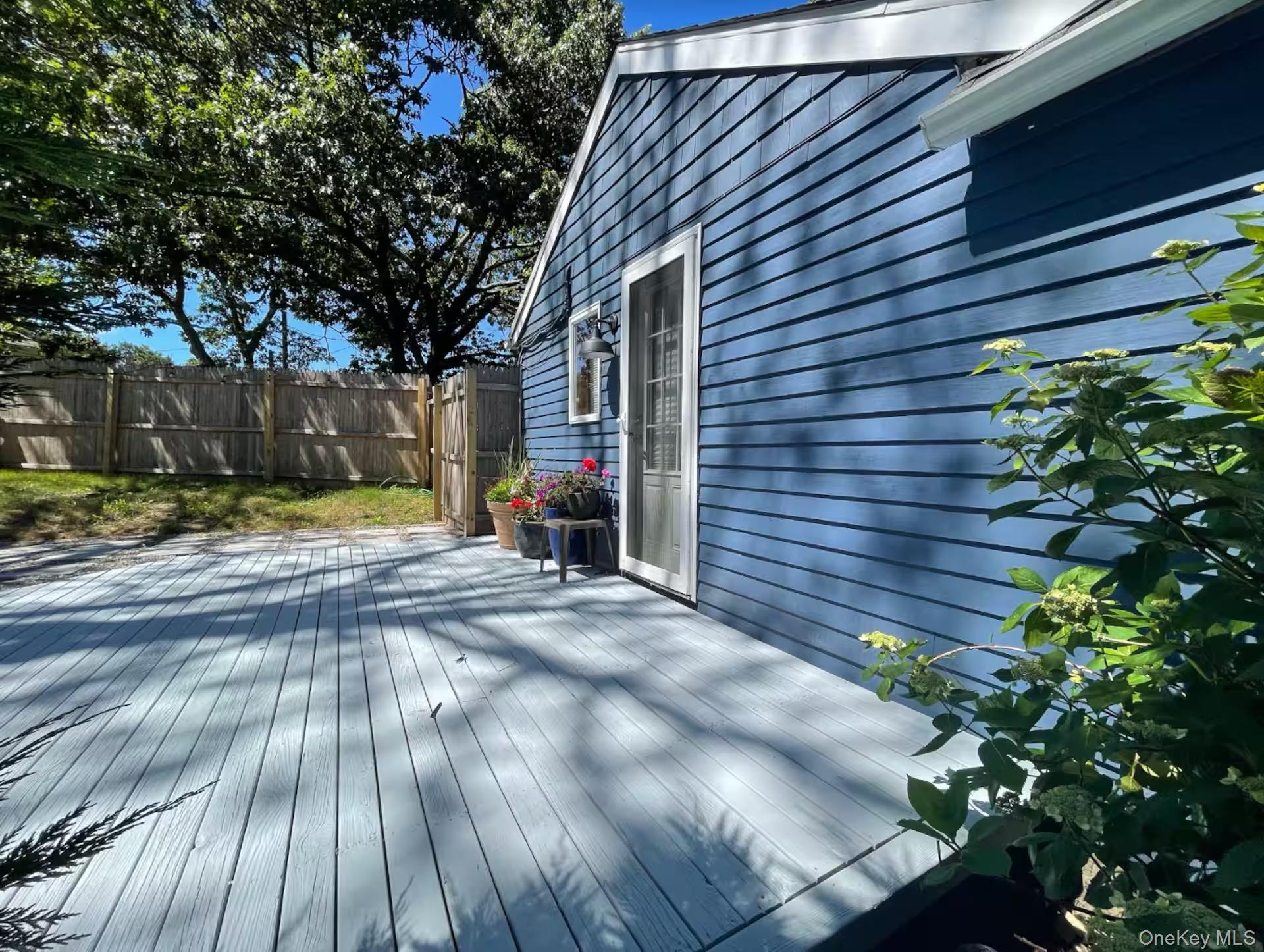 332 Canoe Place Road Southampton, NY 11968 - Photo 18 of 19 a view of a house with a yard