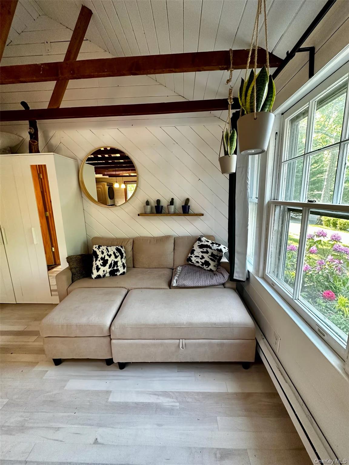 332 Canoe Place Road Southampton, NY 11968 - Photo 4 of 19 a living room with furniture and a window