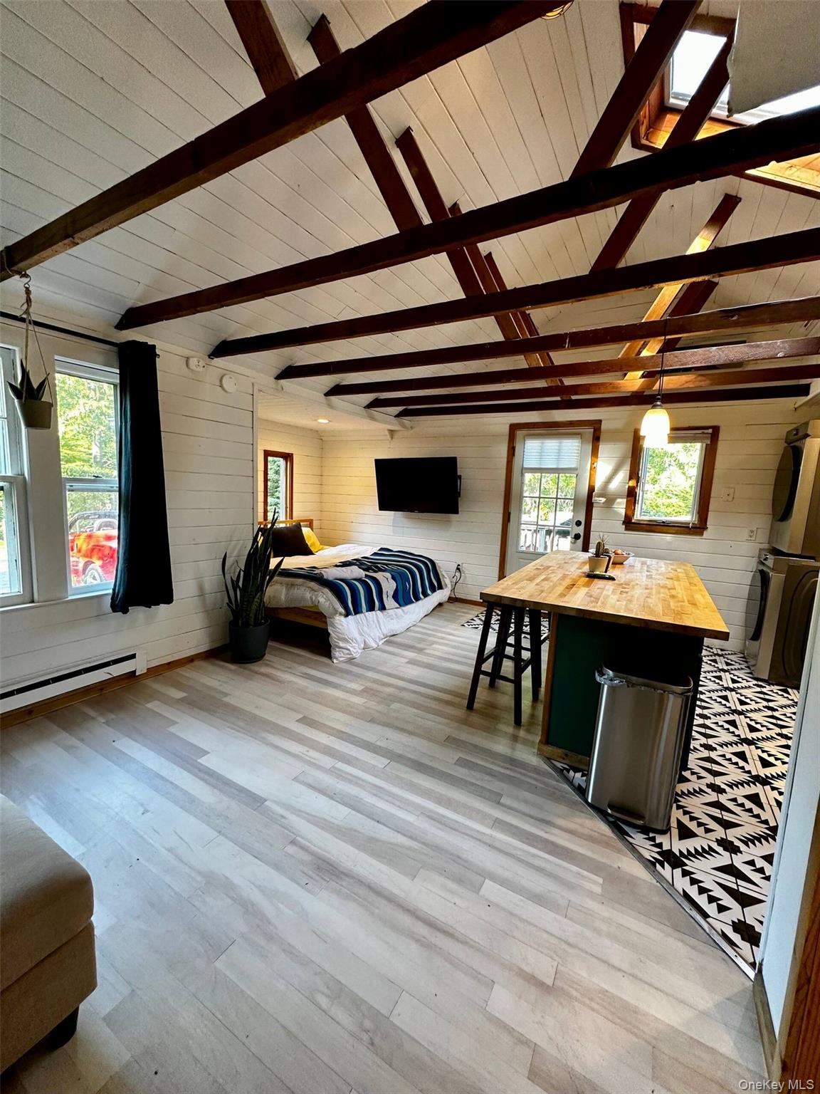 332 Canoe Place Road Southampton, NY 11968 - Photo 5 of 19 a view of a livingroom with furniture and window