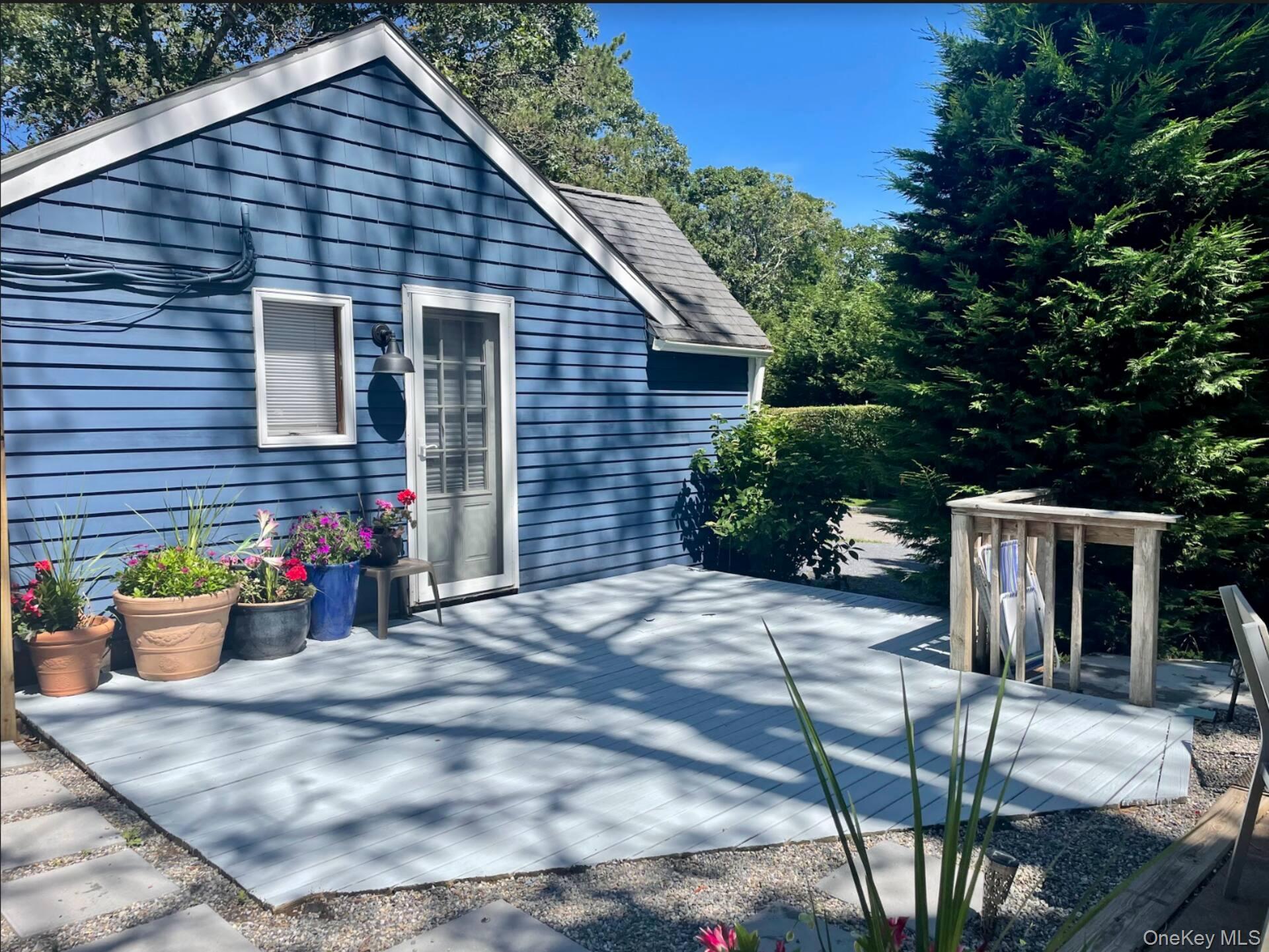 332 Canoe Place Road Southampton, NY 11968 - Photo 8 of 19 a view of a house with patio