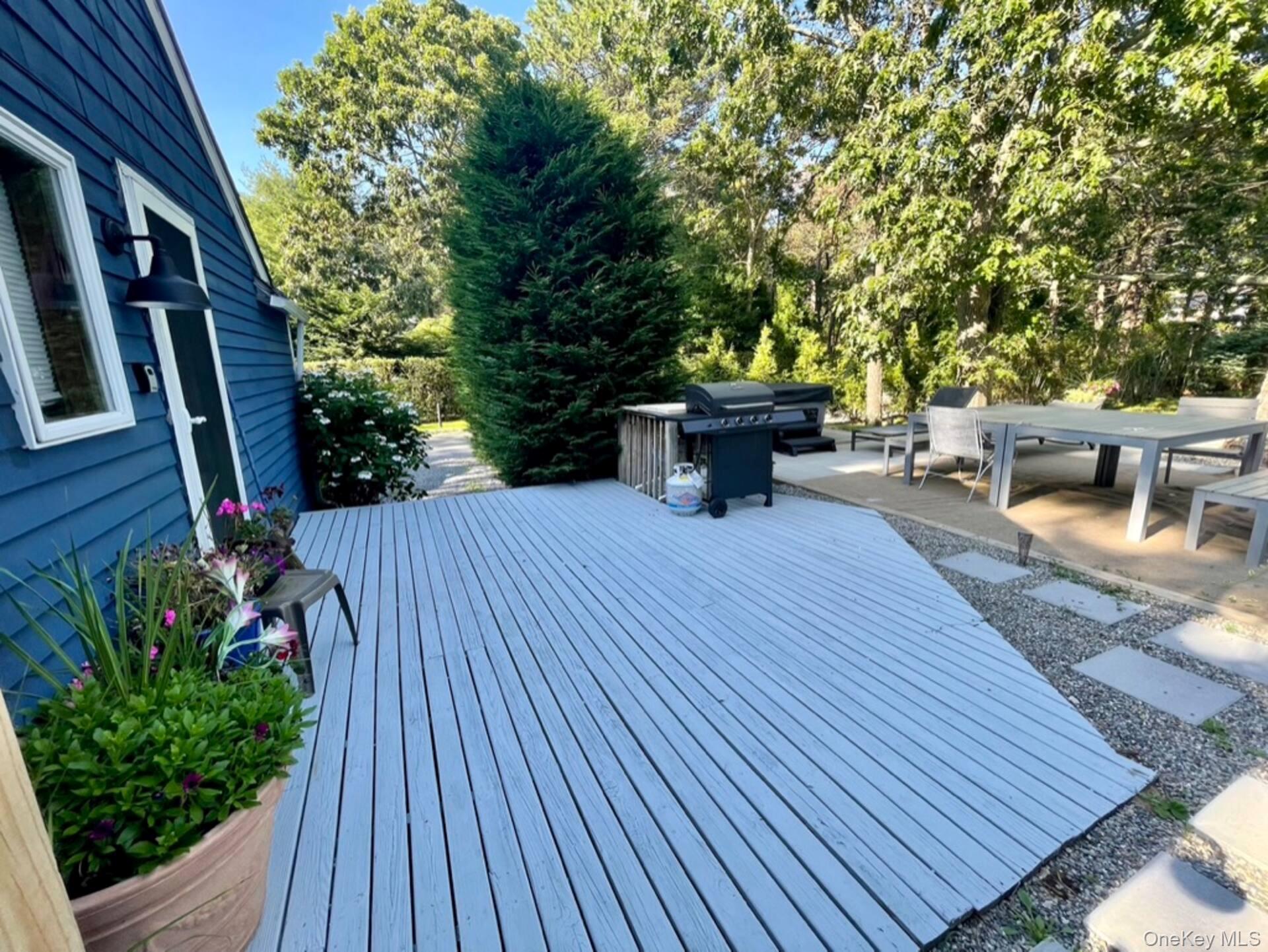 332 Canoe Place Road Southampton, NY 11968 - Photo 9 of 19 a view of a backyard with sitting area