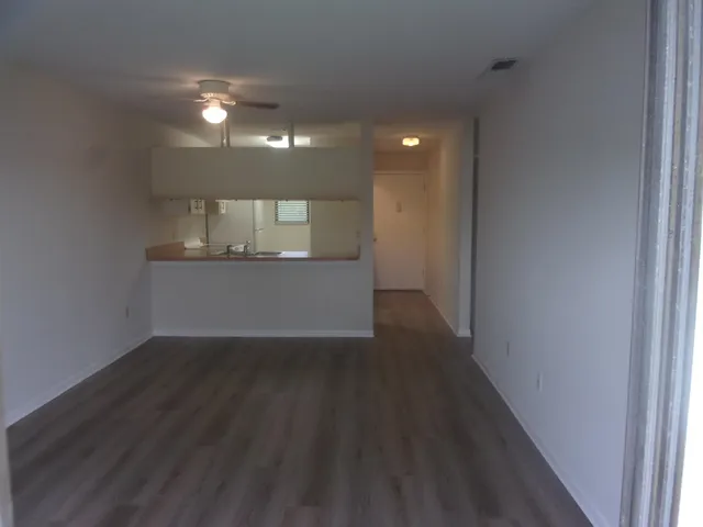 a view of a kitchen cabinets and a wooden floor