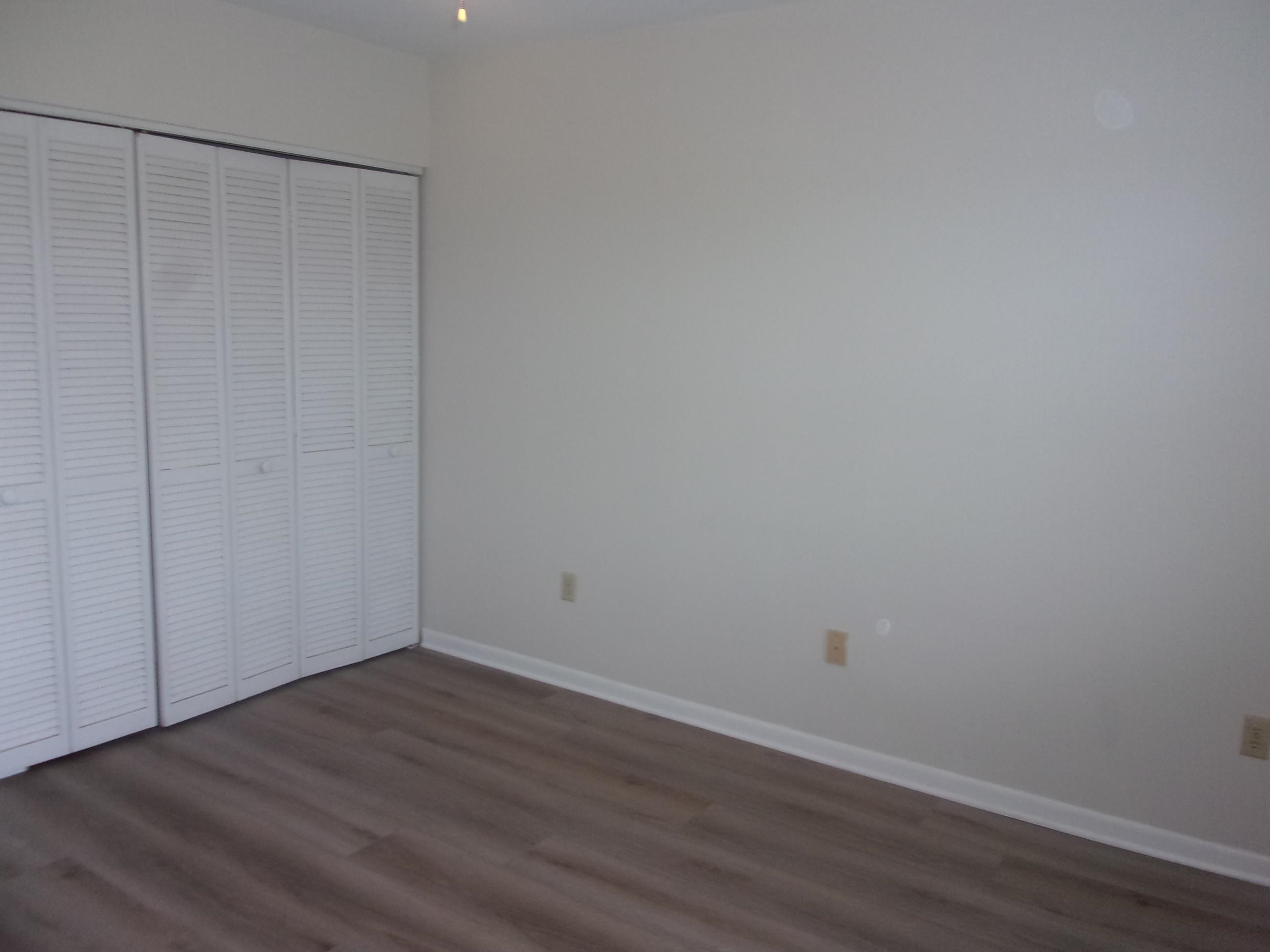 700 West Pope Road St. Augustine, FL 32080 - Photo 21 of 32 a view of a room with wooden floor