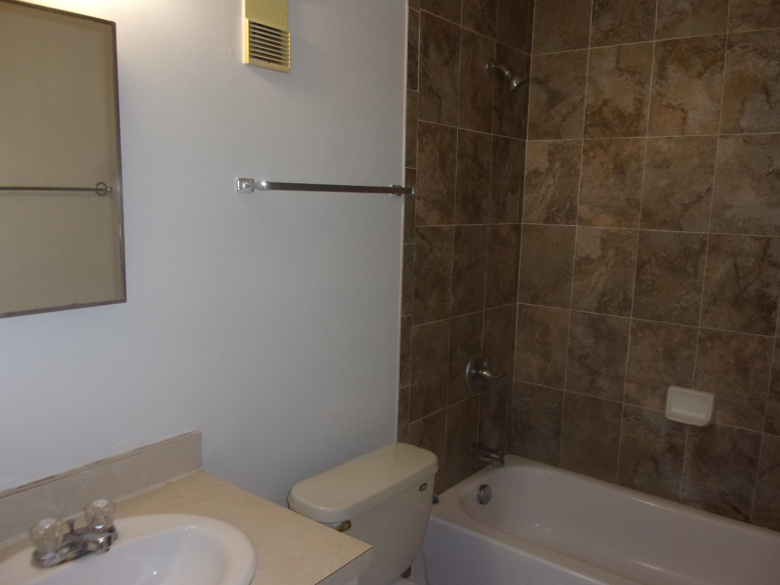 700 West Pope Road St. Augustine, FL 32080 - Photo 22 of 32 a bath room with a toilet and bath tub