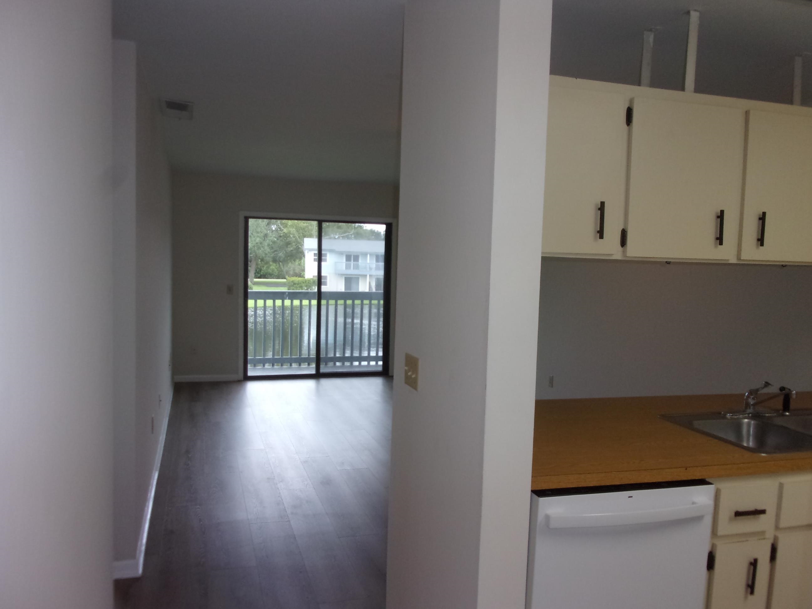 700 West Pope Road St. Augustine, FL 32080 - Photo 6 of 32 a view of a room with a window and wooden floor
