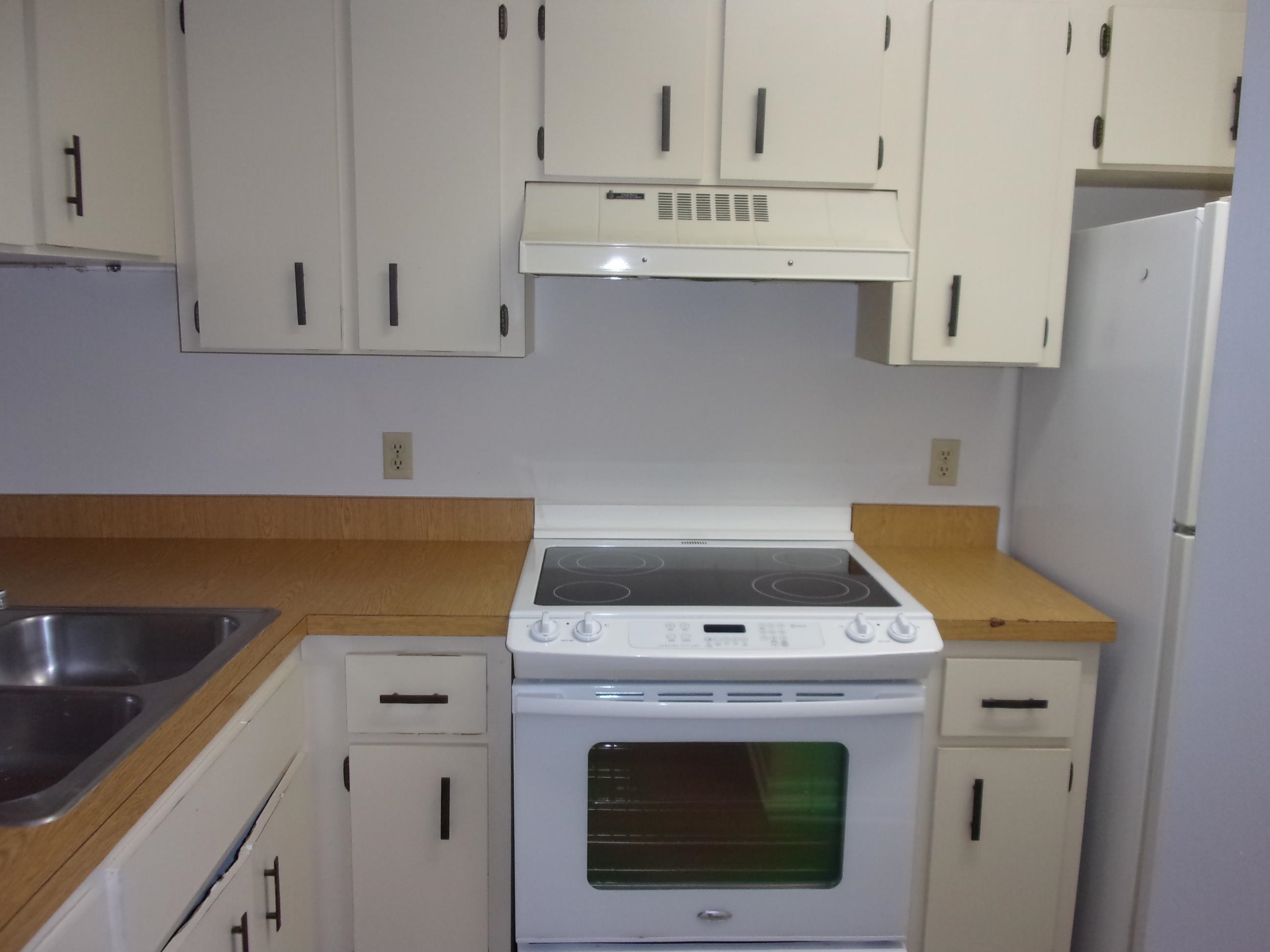 700 West Pope Road St. Augustine, FL 32080 - Photo 10 of 32 a utility room with stainless steel appliances white cabinets and a sink