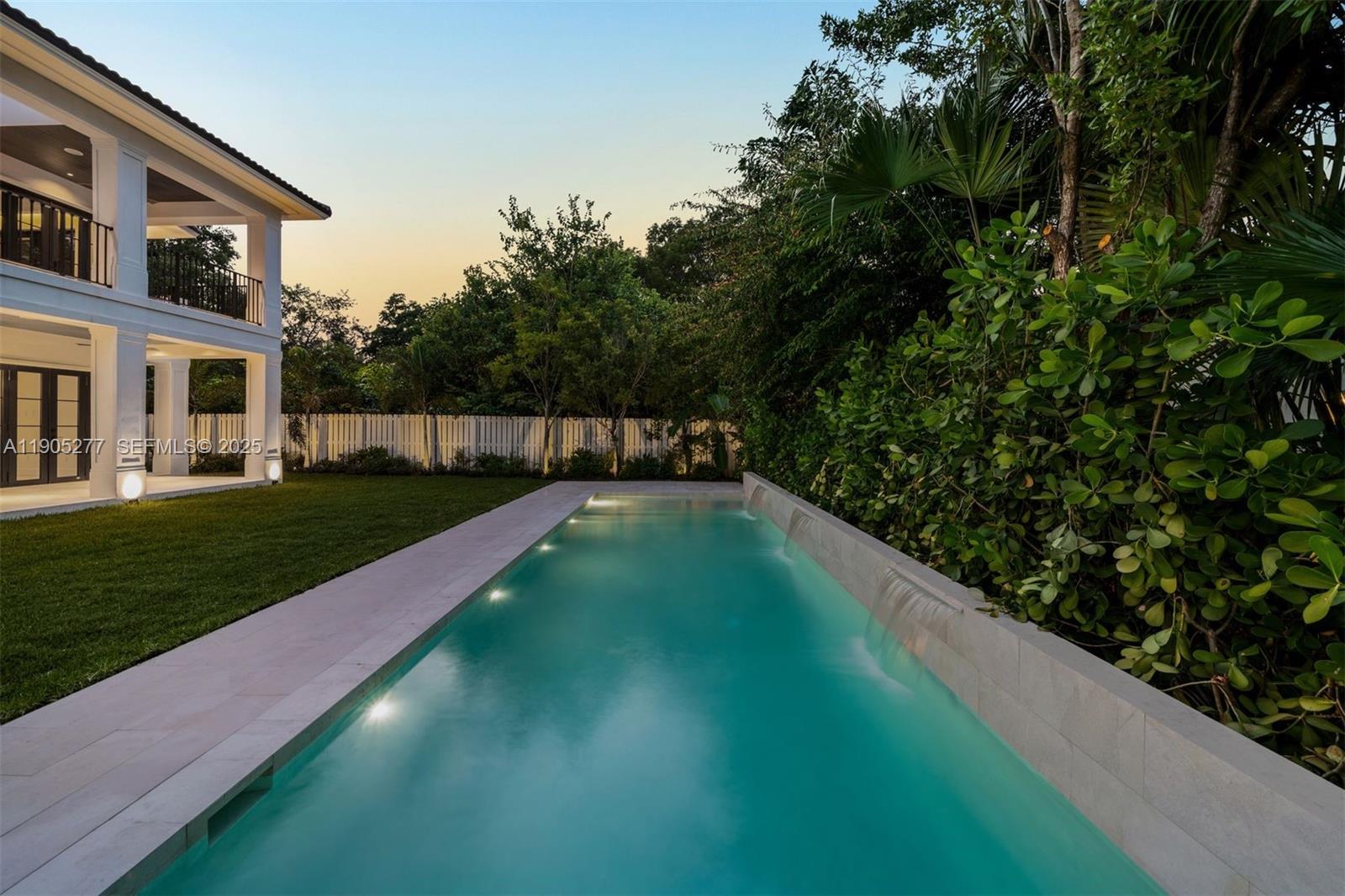 4191 Battersea Road Miami, FL 33133 - Photo 14 of 27 a view of a backyard with a garden