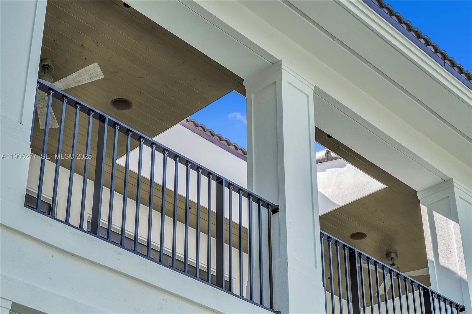 4191 Battersea Road Miami, FL 33133 - Photo 16 of 27 a view of staircase with railing and white walls