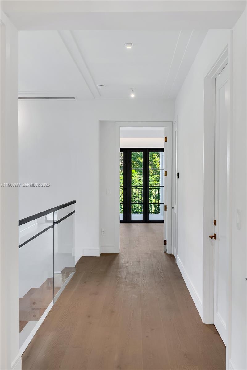 4191 Battersea Road Miami, FL 33133 - Photo 17 of 27 a view of an empty room with a window